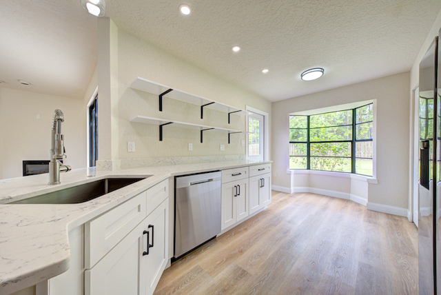 White shaker kitchen with marble countertops