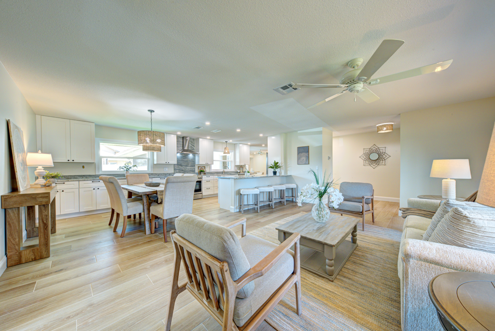 Open living, dining, and kitchen renovation